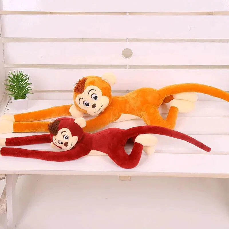 Peluche singe qui s'accroche
