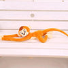 Peluche singe qui s'accroche