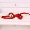 Peluche singe qui s'accroche