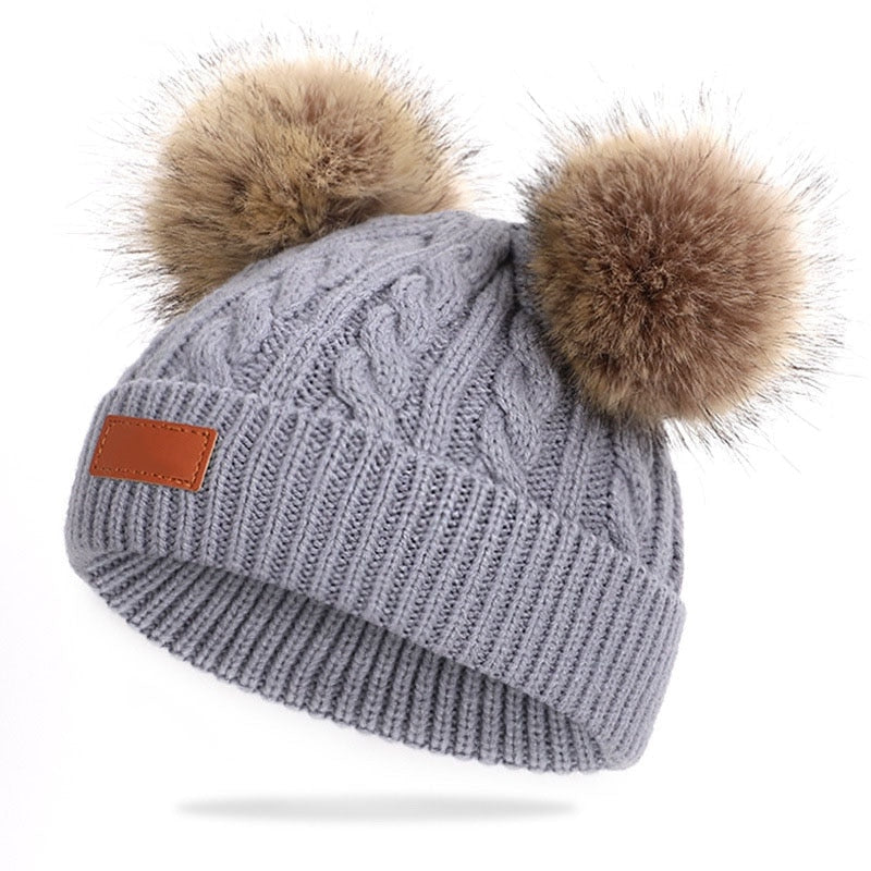 Bonnet en laine double pompon pour enfants