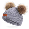 Bonnet en laine double pompon pour enfants