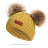 Bonnet en laine double pompon pour enfants